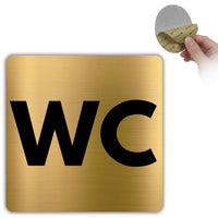 LEIASA | WC Schild Toilette - 10x10 cm - Aluminium Gold - Toilettenschild Damen Herren - WC Aufkleber Goldfarben - Türschild Badezimmer - Quadratisch - Robust - Grosor 0.8mm - (WC)