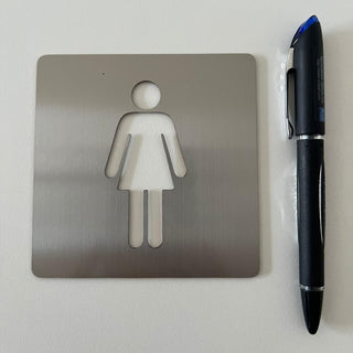 Señal WC Mujer: material premium resistente a rayos UV y agua